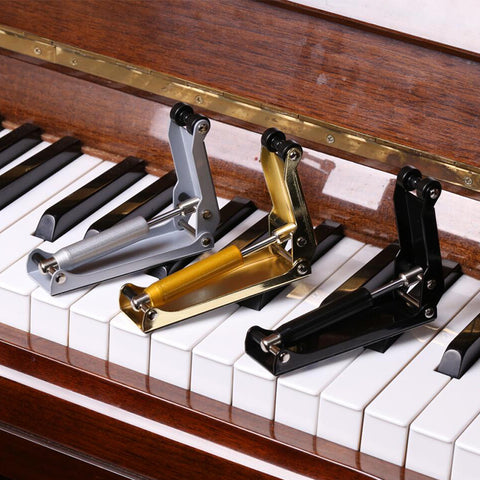 Slow locking mechanism for acoustic pianos OSKAR MARTIN